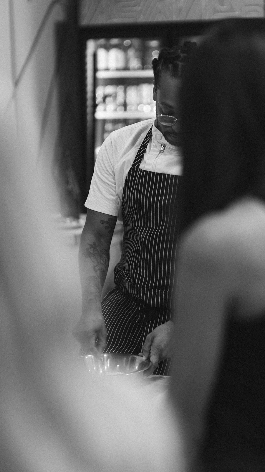 A chef in an apron in the Pasta Packs kitchen